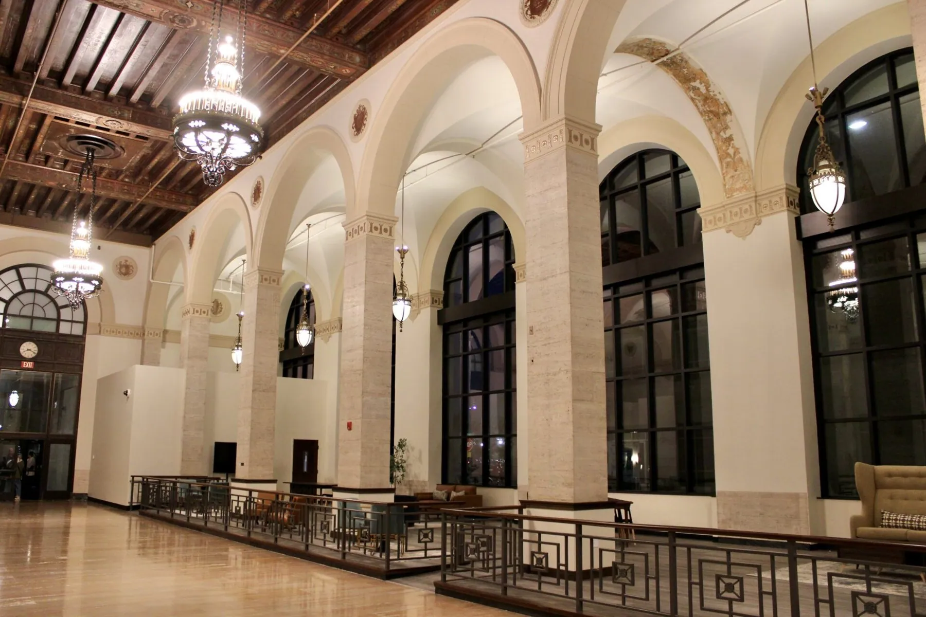 Arched windows, chandeliers and coffered ceiling in The Reserve at The Banc
