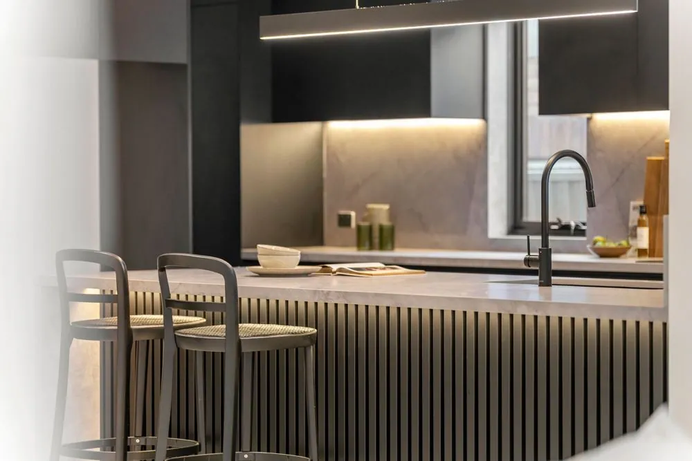 Modern kitchen with bar seating at The Wooster